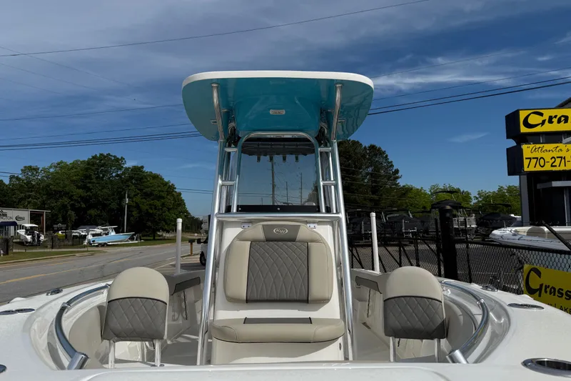 Slide: The Image of 2026 Key West 239 FS boat with seating, displayed outdoors under a clear sky. - 6