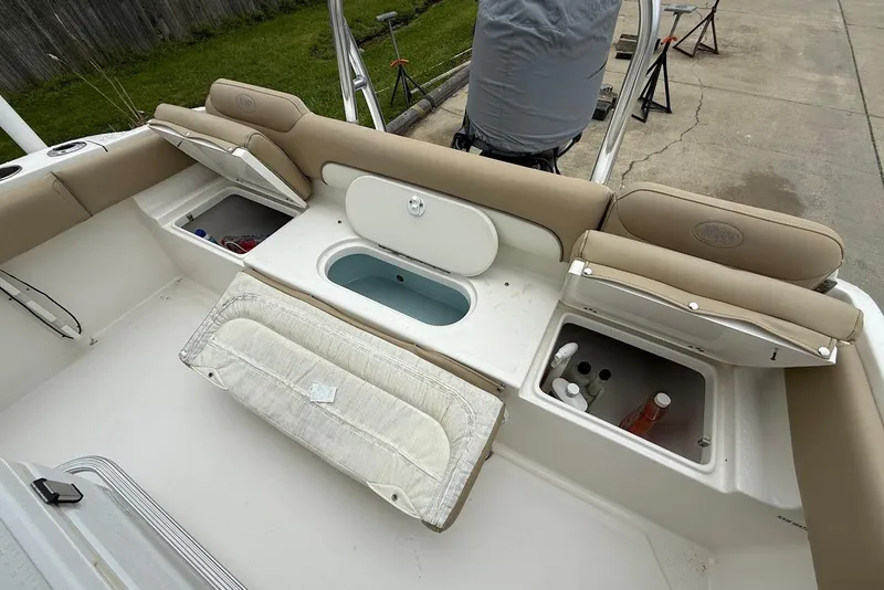 Slide: The Image of 2016 Key West 219 FS boat interior with storage compartments and seating. - 21