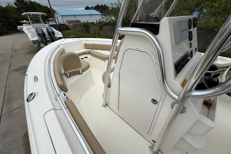 Slide: The Image of 2016 Key West 219 FS boat with beige seating and control panel. - 28