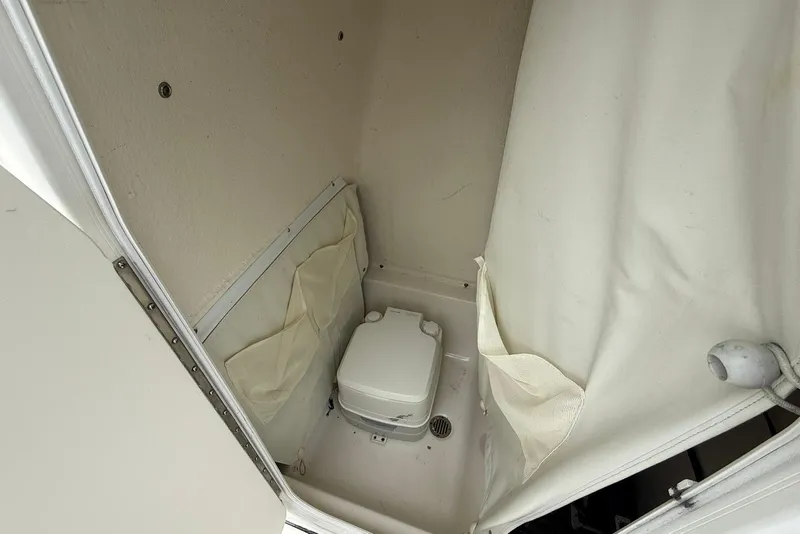 Slide: The Image of Compact marine toilet in 2016 Key West 219 FS boat cabin. - 29
