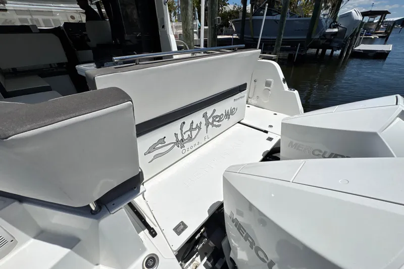 Slide: The Image of 2021 Beneteau Antares 11 boat with Mercury engines, docked near water. - 12