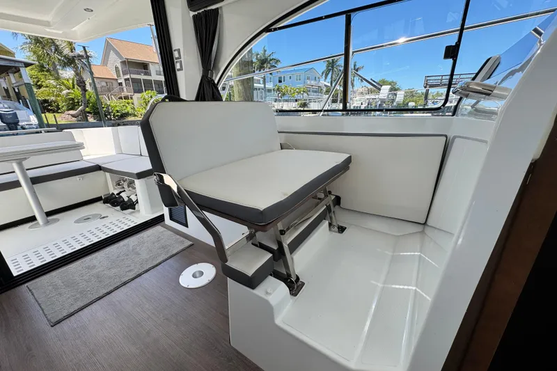Slide: The Image of Interior of 2021 Beneteau Antares 11 boat, featuring seating and modern design. - 26