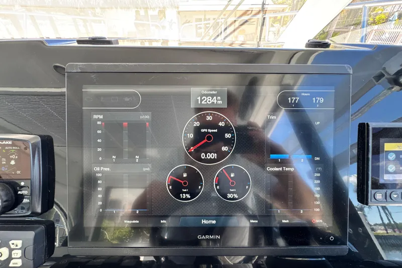 Slide: The Image of Garmin display on 2021 Beneteau Antares 11 showing engine metrics and navigation data. - 38