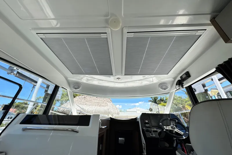 Slide: The Image of Interior view of 2021 Beneteau Antares 11 boat cockpit with modern design and panoramic windows. - 40