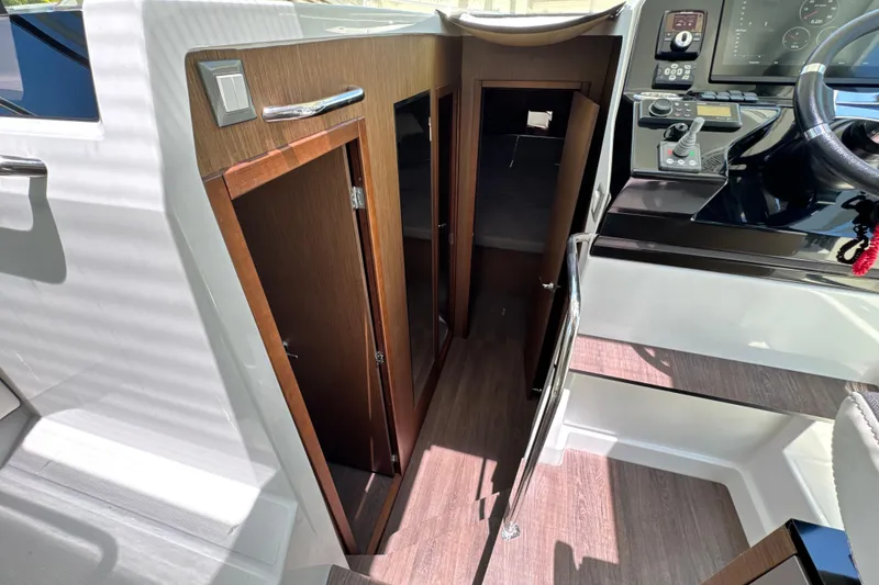 Slide: The Image of Interior view of 2021 Beneteau Antares 11, showcasing cabin entrance and helm controls. - 44