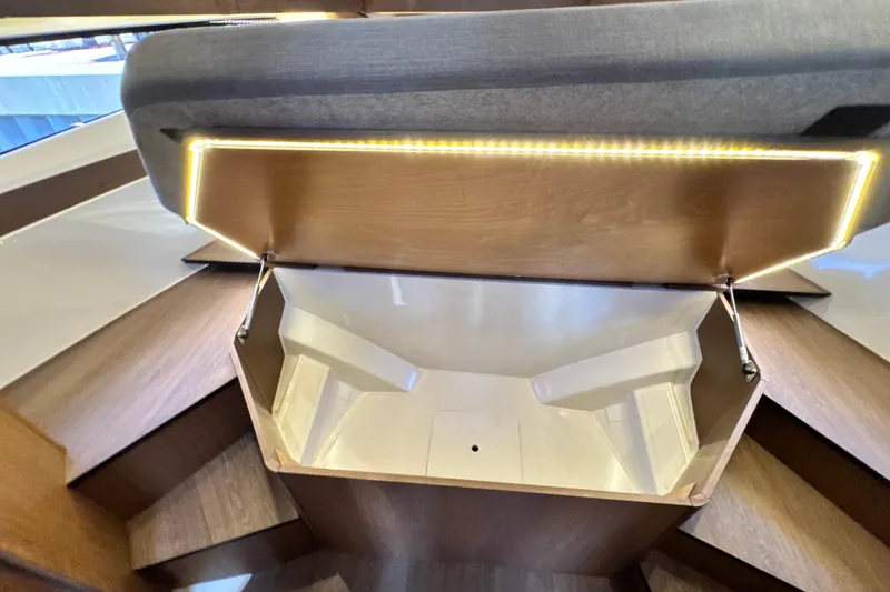 Slide: The Image of Interior storage compartment of 2021 Beneteau Antares 11 boat with LED lighting. - 49