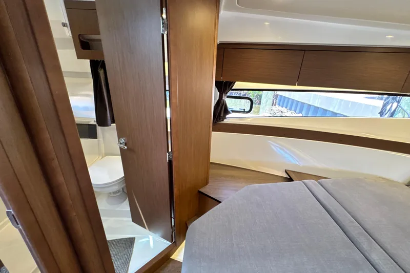 Slide: The Image of Interior of 2021 Beneteau Antares 11, featuring a cozy cabin and modern bathroom. - 52
