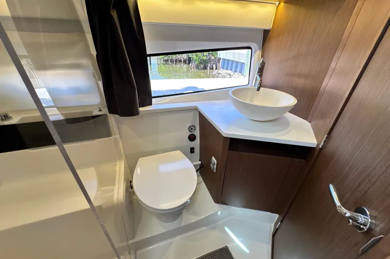 Slide: The Image of Modern bathroom interior on 2021 Beneteau Antares 11 yacht, featuring sleek fixtures and wood accents. - 56