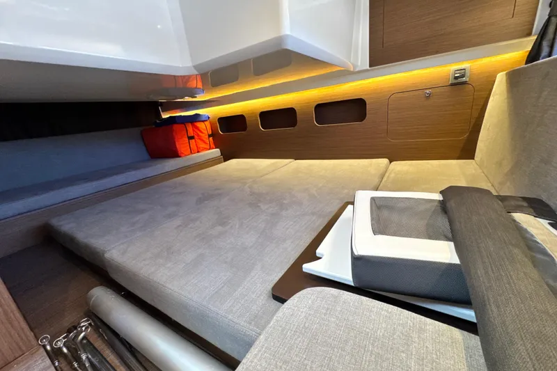 Slide: The Image of Interior cabin of 2021 Beneteau Antares 11 with cozy seating and ambient lighting. - 60