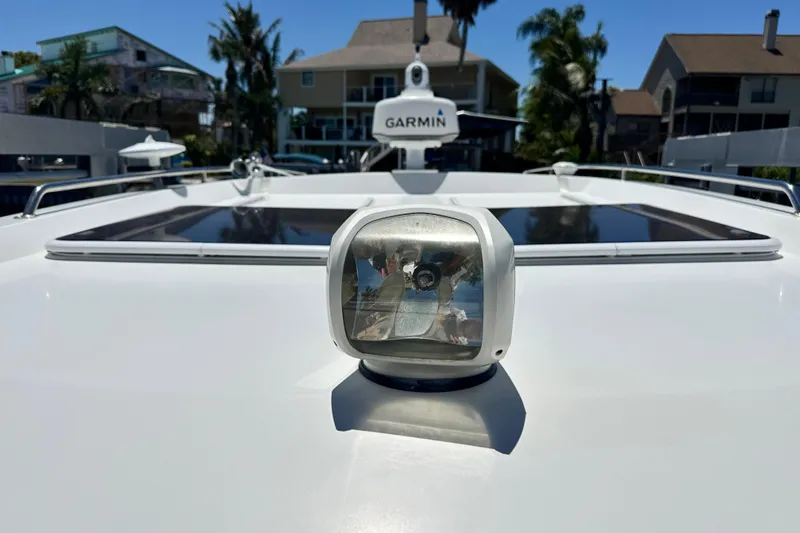 Slide: The Image of 2021 Beneteau Antares 11 boat deck with Garmin radar and spotlight. - 66