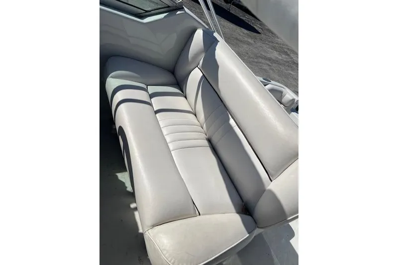 Slide: The Image of 1997 Crownline 250 CR boat interior with white leather seating. - 11