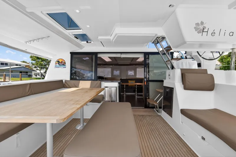Slide: The Image of Spacious deck of 2015 Fountaine Pajot Helia 44 catamaran with seating and dining area. - 10
