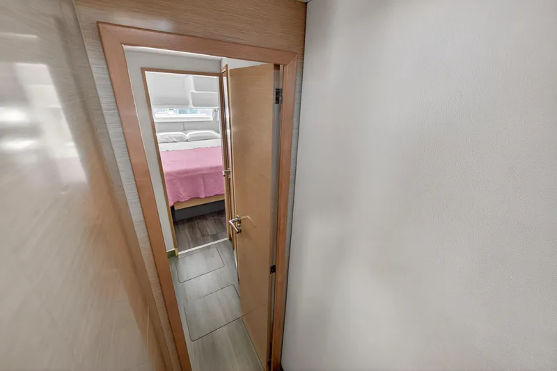 Slide: The Image of Interior view of a 2015 Fountaine Pajot Helia 44 catamaran cabin with pink bedding. - 100