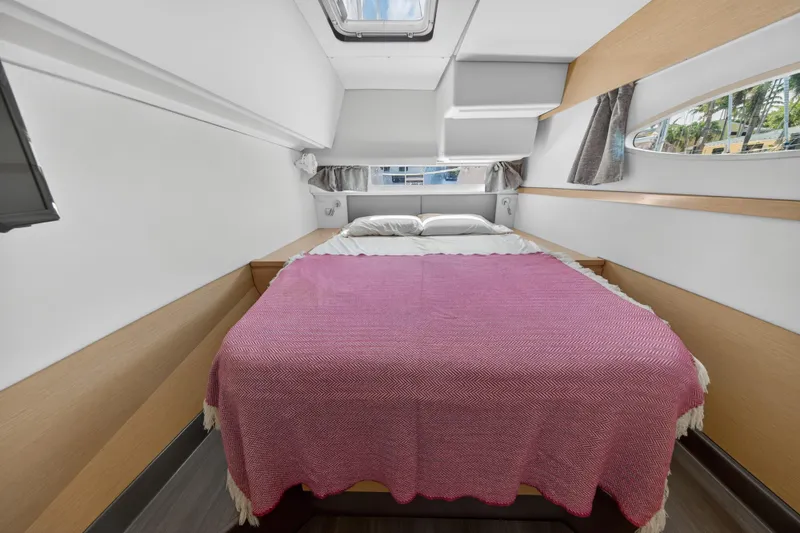 Slide: The Image of Cabin interior of 2015 Fountaine Pajot Helia 44 with cozy bed and window view. - 101