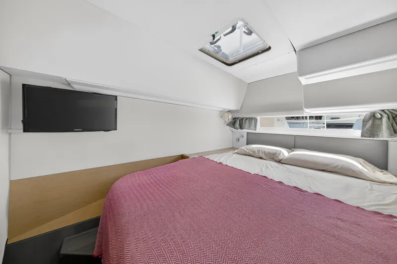 Slide: The Image of Interior cabin of 2015 Fountaine Pajot Helia 44 catamaran with bed and TV. - 102