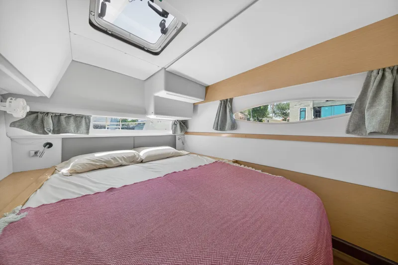 Slide: The Image of Interior cabin of 2015 Fountaine Pajot Helia 44 catamaran with cozy bed and window views. - 103