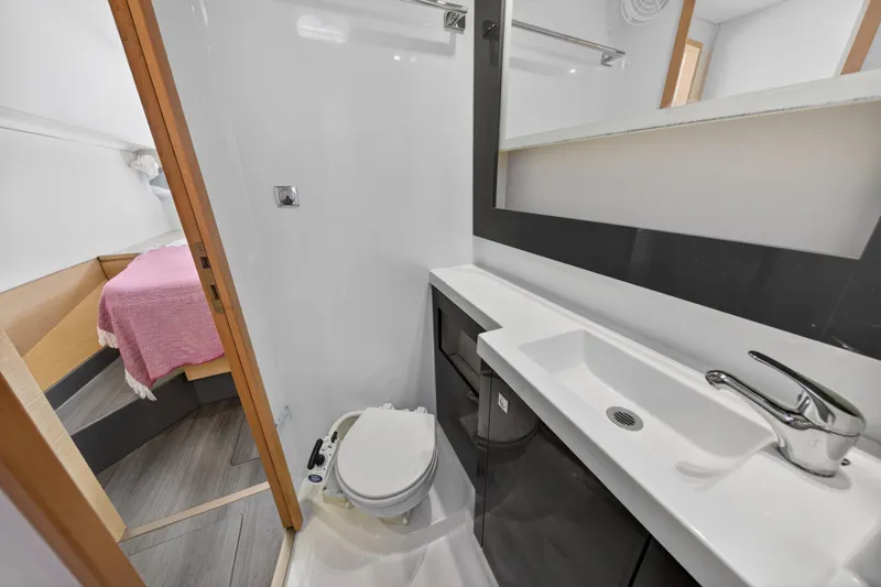 Slide: The Image of Bathroom interior of 2015 Fountaine Pajot Helia 44 catamaran, featuring modern sink and toilet. - 105