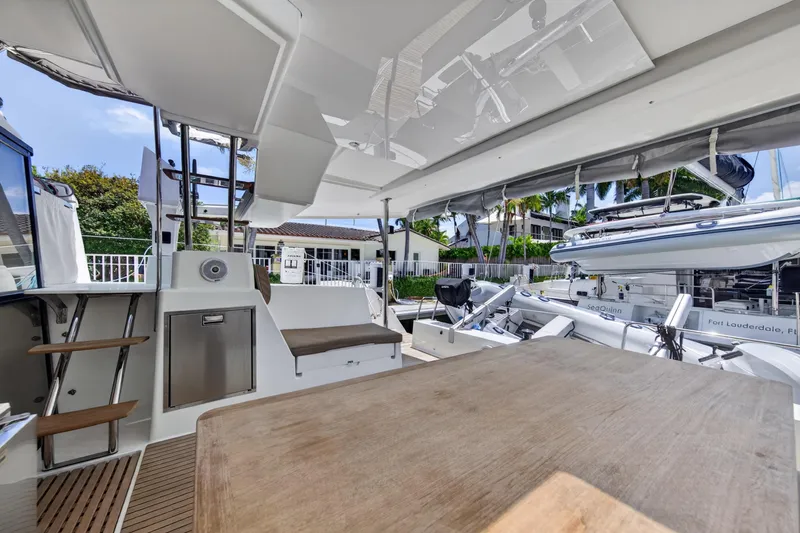 Slide: The Image of Spacious deck of 2015 Fountaine Pajot Helia 44 catamaran docked in Fort Lauderdale. - 12