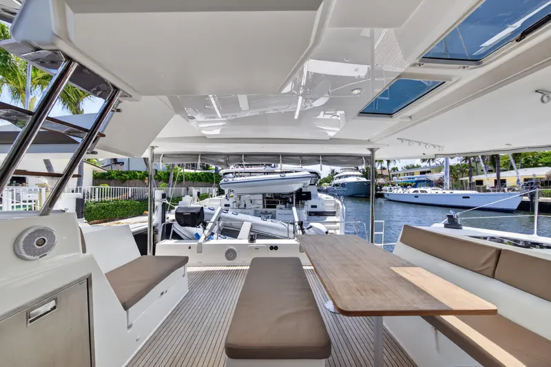 Slide: The Image of Spacious deck of 2015 Fountaine Pajot Helia 44 catamaran with seating and table. - 13