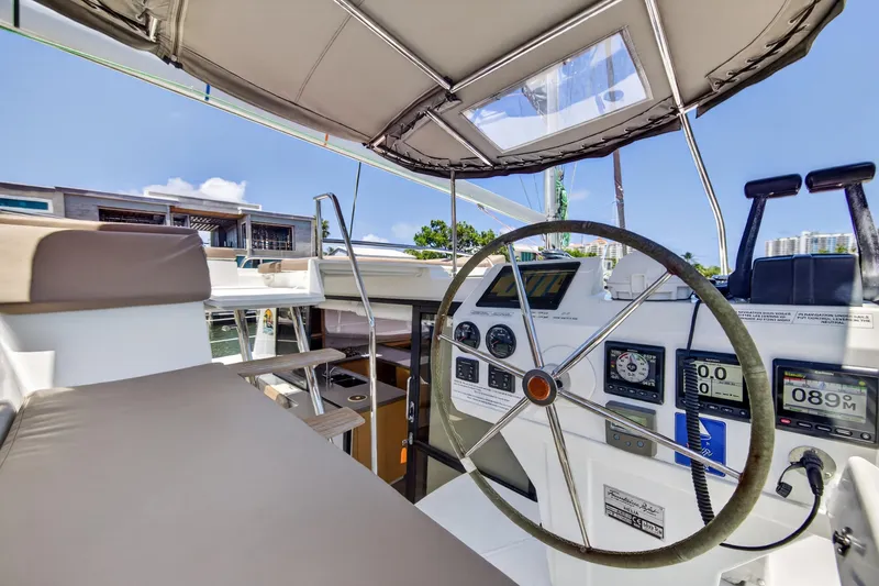Slide: The Image of Helm of 2015 Fountaine Pajot Helia 44 catamaran with navigation instruments and seating. - 25