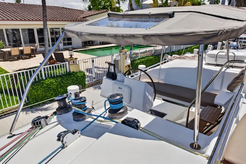 Slide: The Image of Fountaine Pajot Helia 44 catamaran cockpit, 2015 model, with winches and seating area. - 26