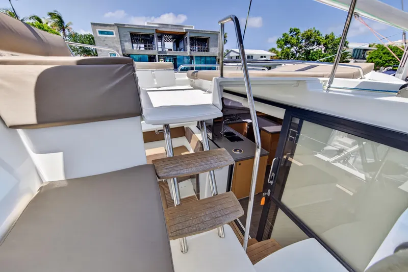 Slide: The Image of 2015 Fountaine Pajot Helia 44 yacht interior with modern seating and sleek design. - 29
