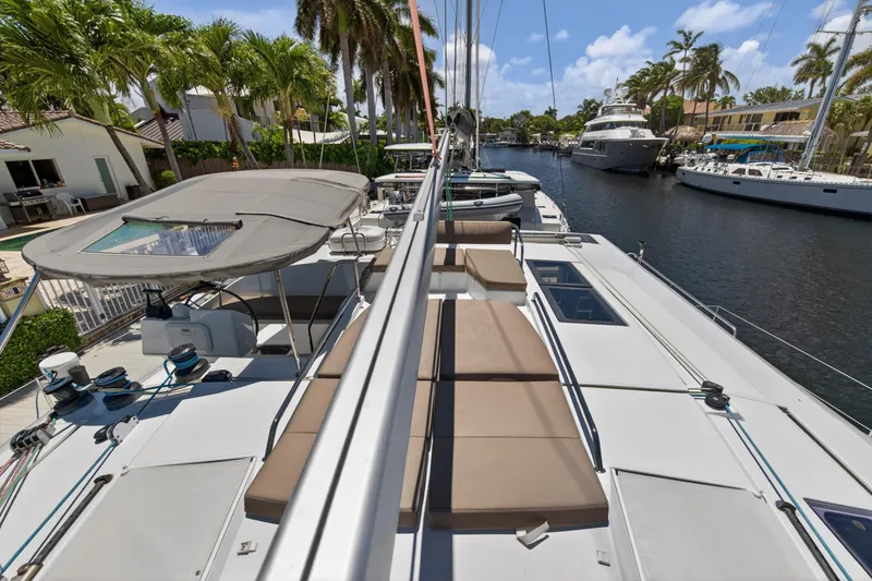 Slide: The Image of 2015 Fountaine Pajot Helia 44 catamaran docked in a sunny marina. - 32
