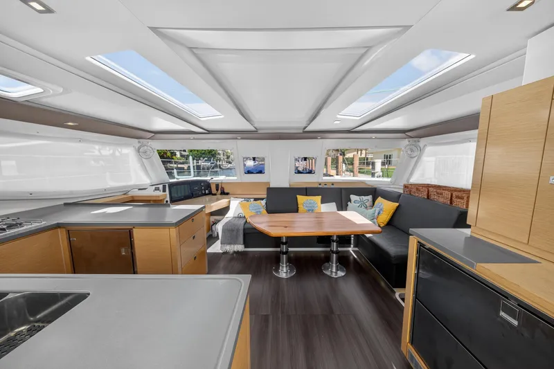 Slide: The Image of Luxurious interior of 2015 Fountaine Pajot Helia 44 catamaran with modern kitchen and seating area. - 49