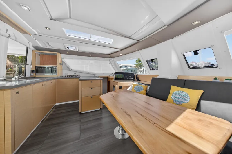 Slide: The Image of Luxurious interior of 2015 Fountaine Pajot Helia 44 catamaran with modern kitchen and seating area. - 50