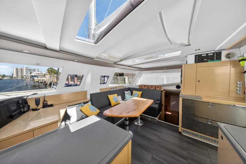 Slide: The Image of Interior of 2015 Fountaine Pajot Helia 44 catamaran with modern seating and dining area. - 51