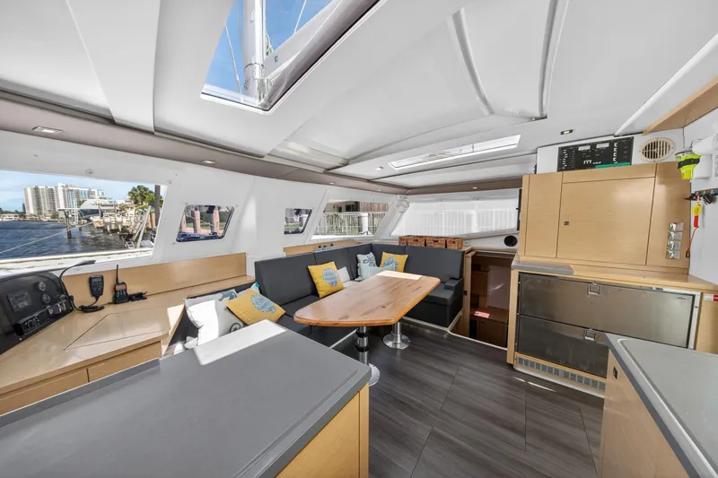 Slide: The Image of Interior of 2015 Fountaine Pajot Helia 44 catamaran with modern seating and dining area. - 52