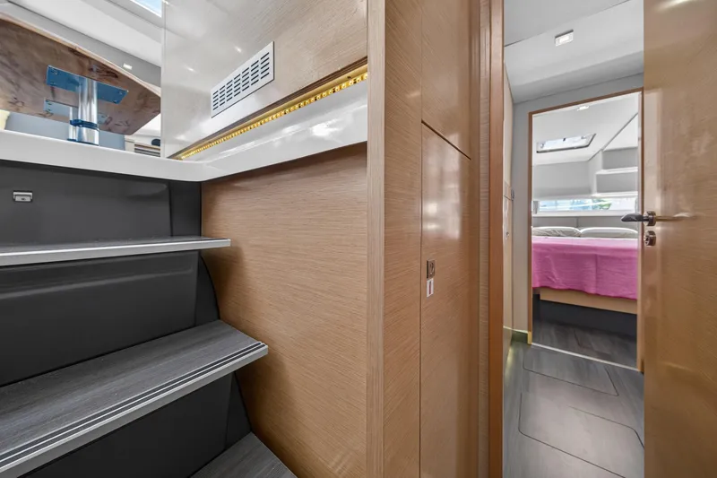 Slide: The Image of Interior of 2015 Fountaine Pajot Helia 44 yacht, featuring stairs and a cozy cabin. - 53