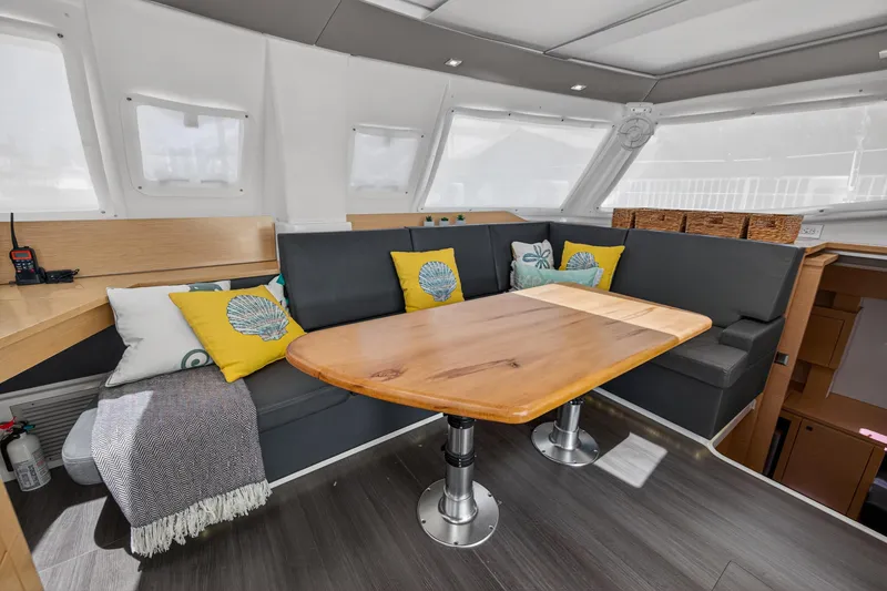 Slide: The Image of Interior of 2015 Fountaine Pajot Helia 44 catamaran with cozy seating and wooden table. - 58