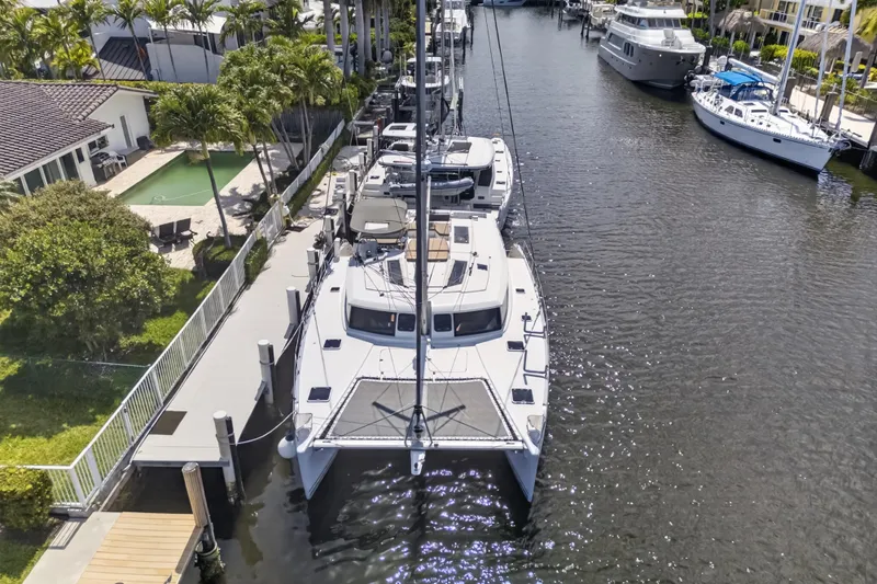 Slide: The Image of Aerial view of 2015 Fountaine Pajot Helia 44 catamaran docked in a scenic marina. - 6