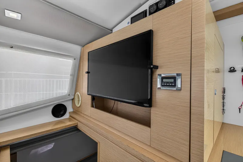 Slide: The Image of Interior of 2015 Fountaine Pajot Helia 44 yacht with mounted TV and control panel. - 60