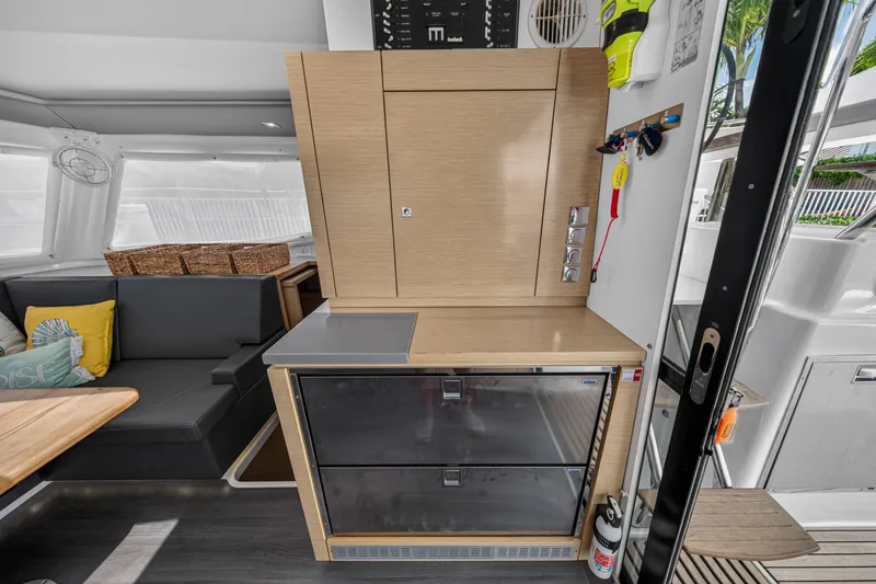 Slide: The Image of Interior of 2015 Fountaine Pajot Helia 44 catamaran with modern cabinetry and seating area. - 62