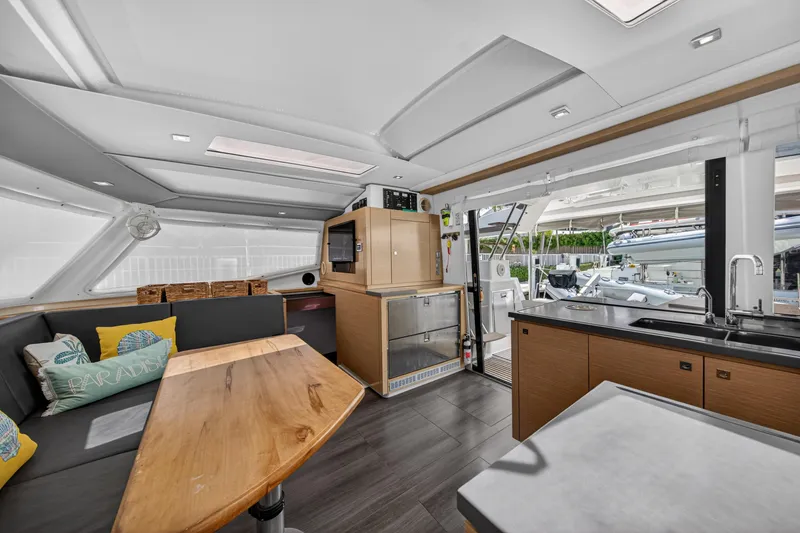 Slide: The Image of Interior of 2015 Fountaine Pajot Helia 44 catamaran with modern kitchen and seating area. - 63