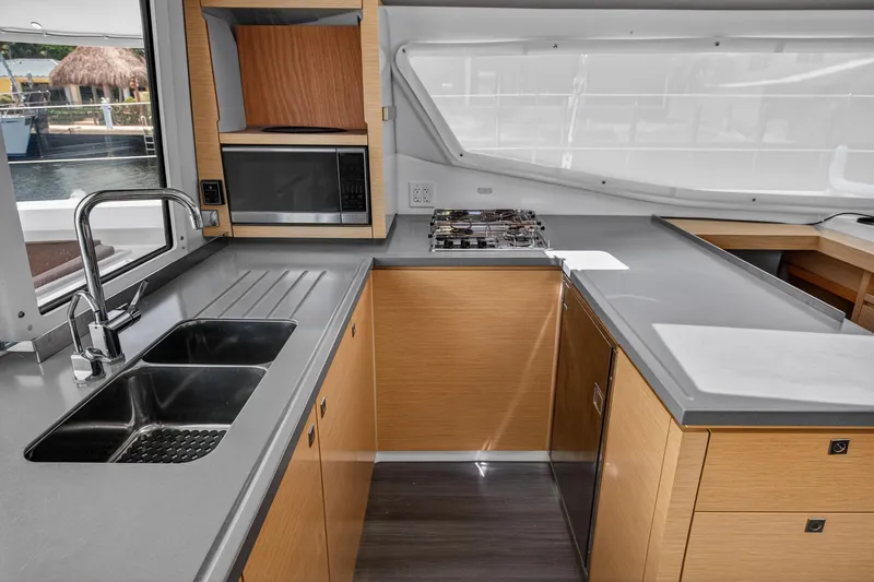 Slide: The Image of Modern kitchen interior of 2015 Fountaine Pajot Helia 44 catamaran with sleek countertops. - 68