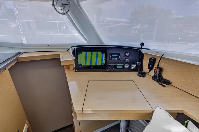 Slide: The Image of Helm station of 2015 Fountaine Pajot Helia 44 catamaran with navigation equipment. - 71