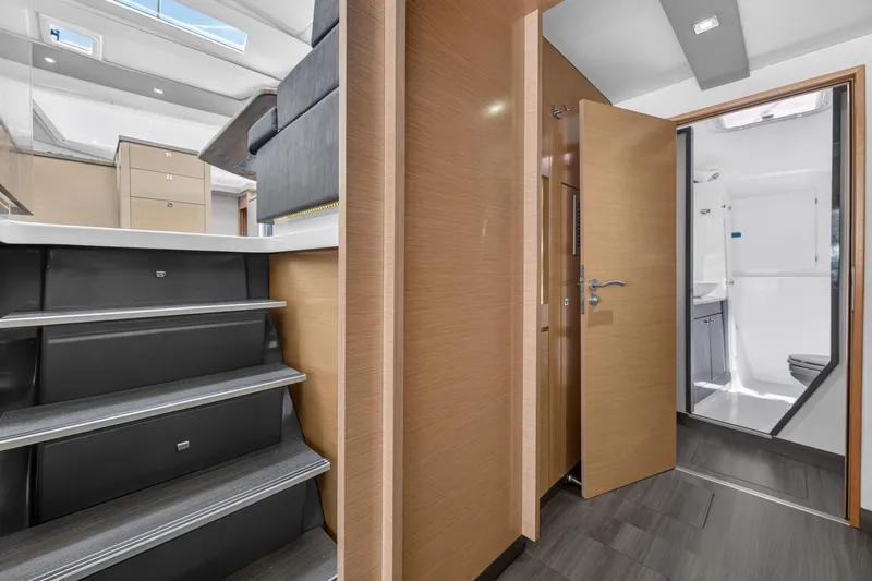 Slide: The Image of Interior of 2015 Fountaine Pajot Helia 44 catamaran, featuring modern design and wooden finishes. - 75