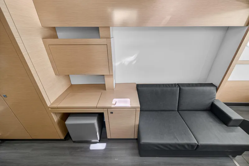 Slide: The Image of Modern interior of 2015 Fountaine Pajot Helia 44 yacht with sleek wood finish and gray sofa. - 82