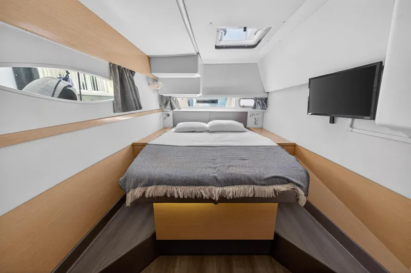 Slide: The Image of Luxurious cabin interior of 2015 Fountaine Pajot Helia 44 catamaran with cozy bed and TV. - 83