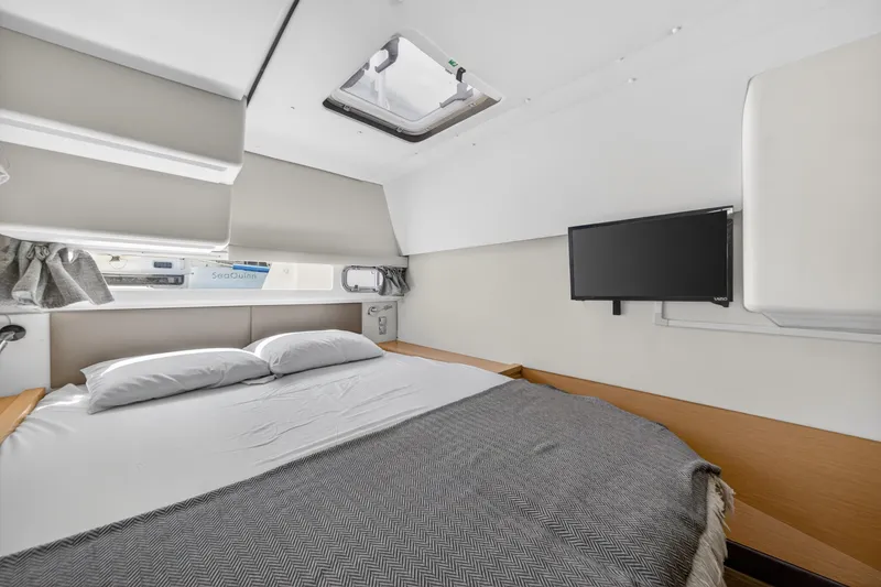 Slide: The Image of Luxurious cabin interior of 2015 Fountaine Pajot Helia 44 catamaran with bed and TV. - 84