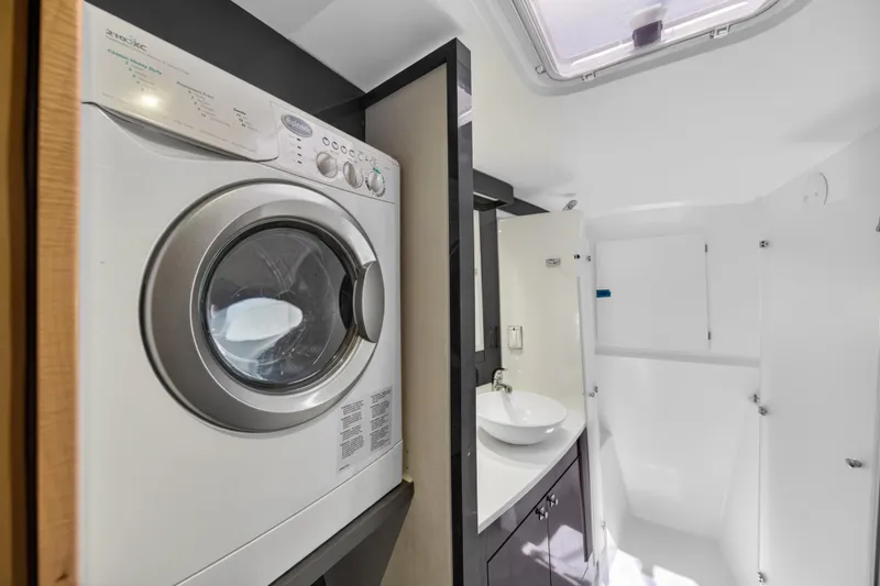 Slide: The Image of Laundry area and bathroom inside 2015 Fountaine Pajot Helia 44 catamaran. - 86