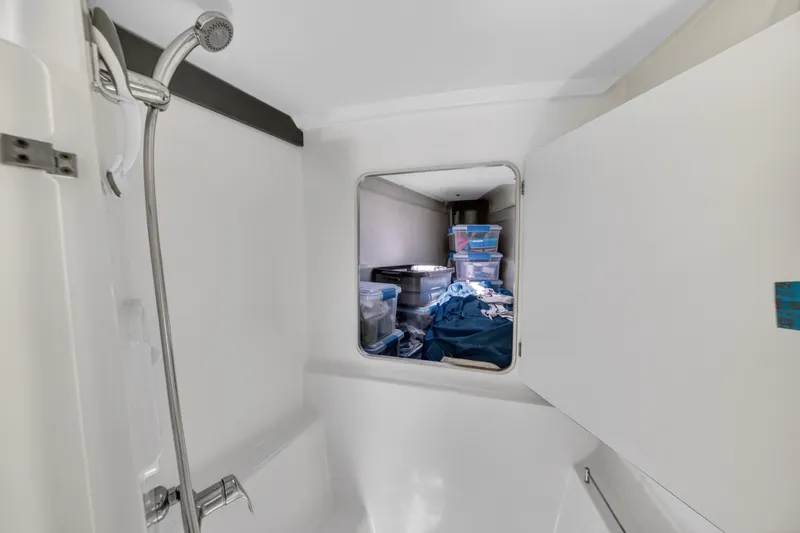 Slide: The Image of Bathroom interior of 2015 Fountaine Pajot Helia 44 catamaran with storage view. - 90