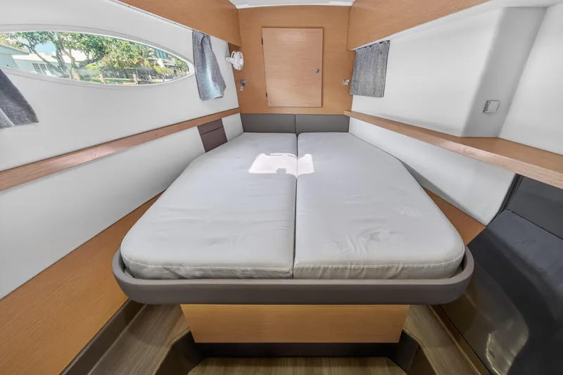 Slide: The Image of Interior cabin of 2015 Fountaine Pajot Helia 44 catamaran with double bed and window view. - 93