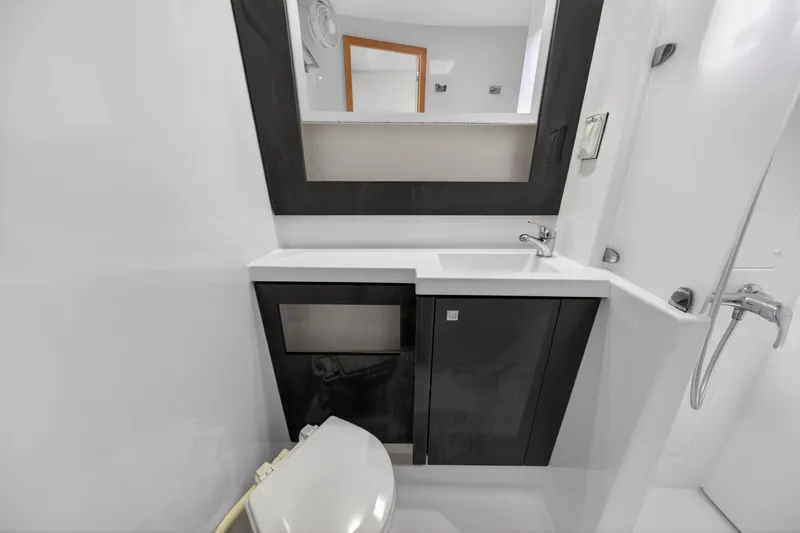 Slide: The Image of Modern bathroom in 2015 Fountaine Pajot Helia 44 catamaran with sleek fixtures and mirror. - 96