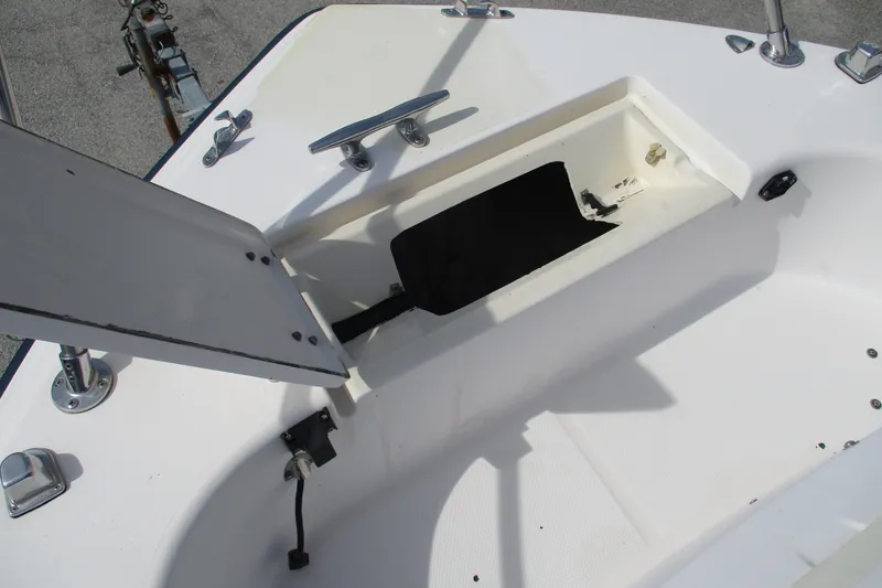 Slide: The Image of Open storage compartment on 1995 Grady-White Adventure 208 boat deck. - 11
