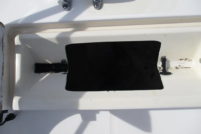 Slide: The Image of Open storage compartment on a 1995 Grady-White Adventure 208 boat. - 12