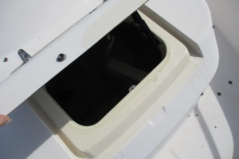 Slide: The Image of Open storage compartment on a 1995 Grady-White Adventure 208 boat. - 13